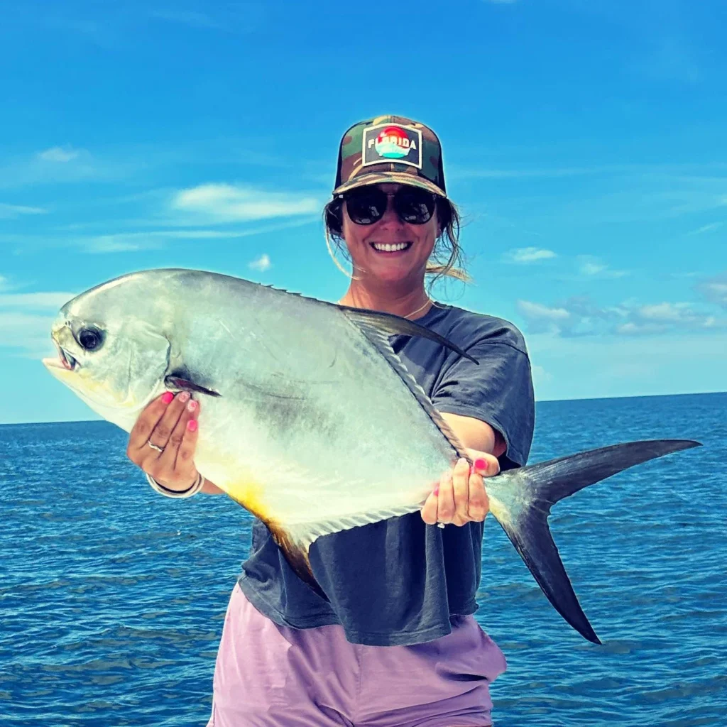 Angler holding a trophy permit caught on a Sarasota nearshore fishing charter.